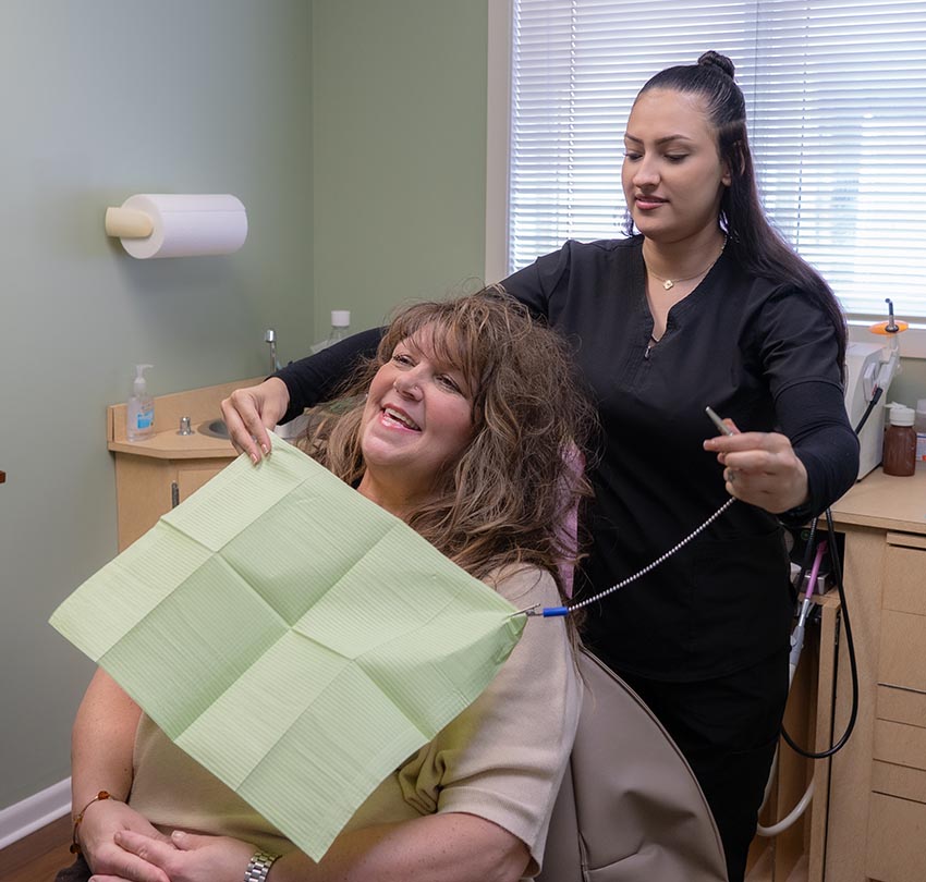 a female dental staff takes care of a patient of Andrew J. Sampalis, DDS and Associates, Ltd